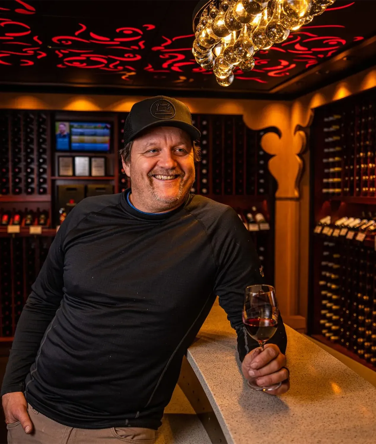 Chris standing with wine