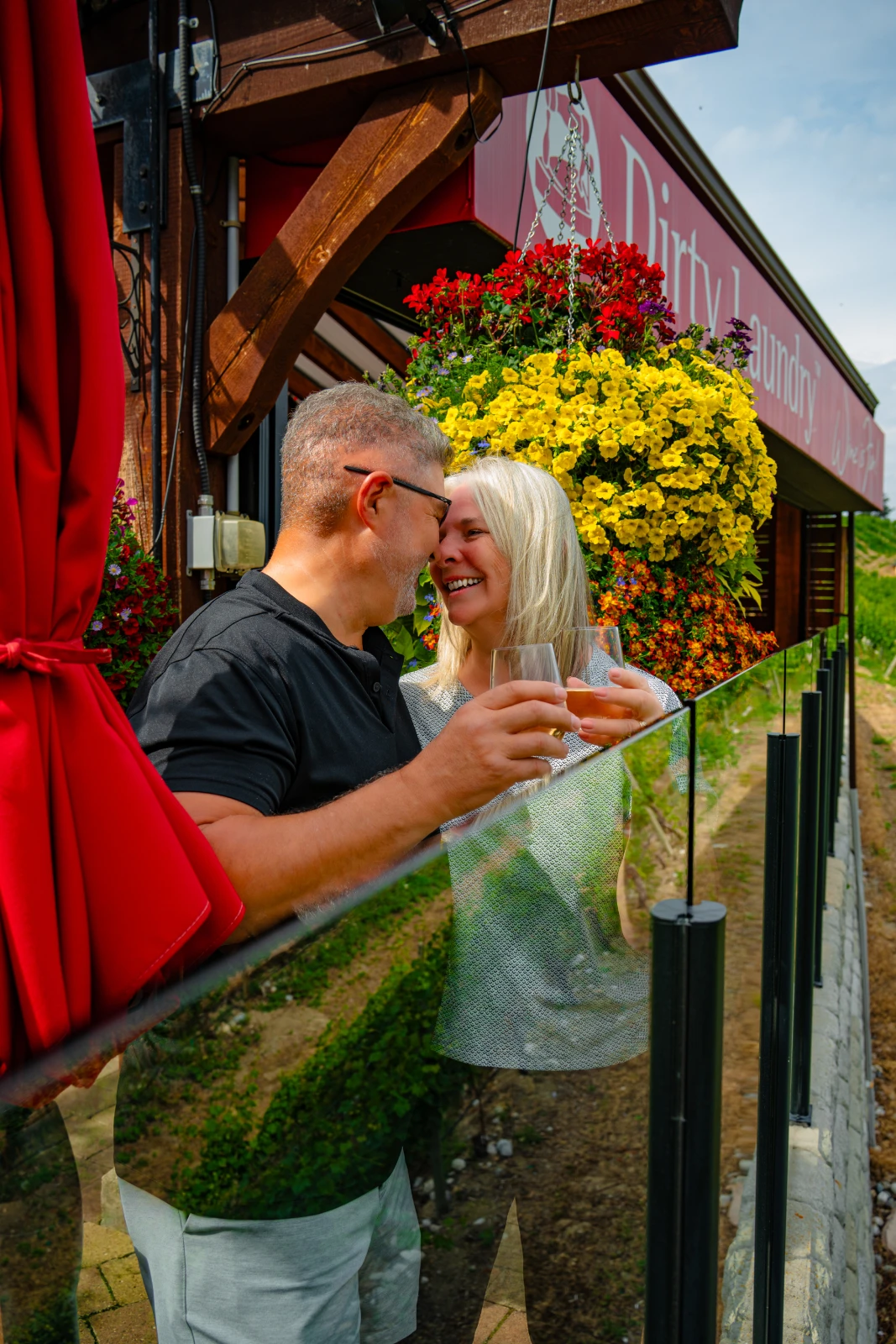 A couple enjoying a glass of wine on the Dirty Laundry Winery outdoor patio