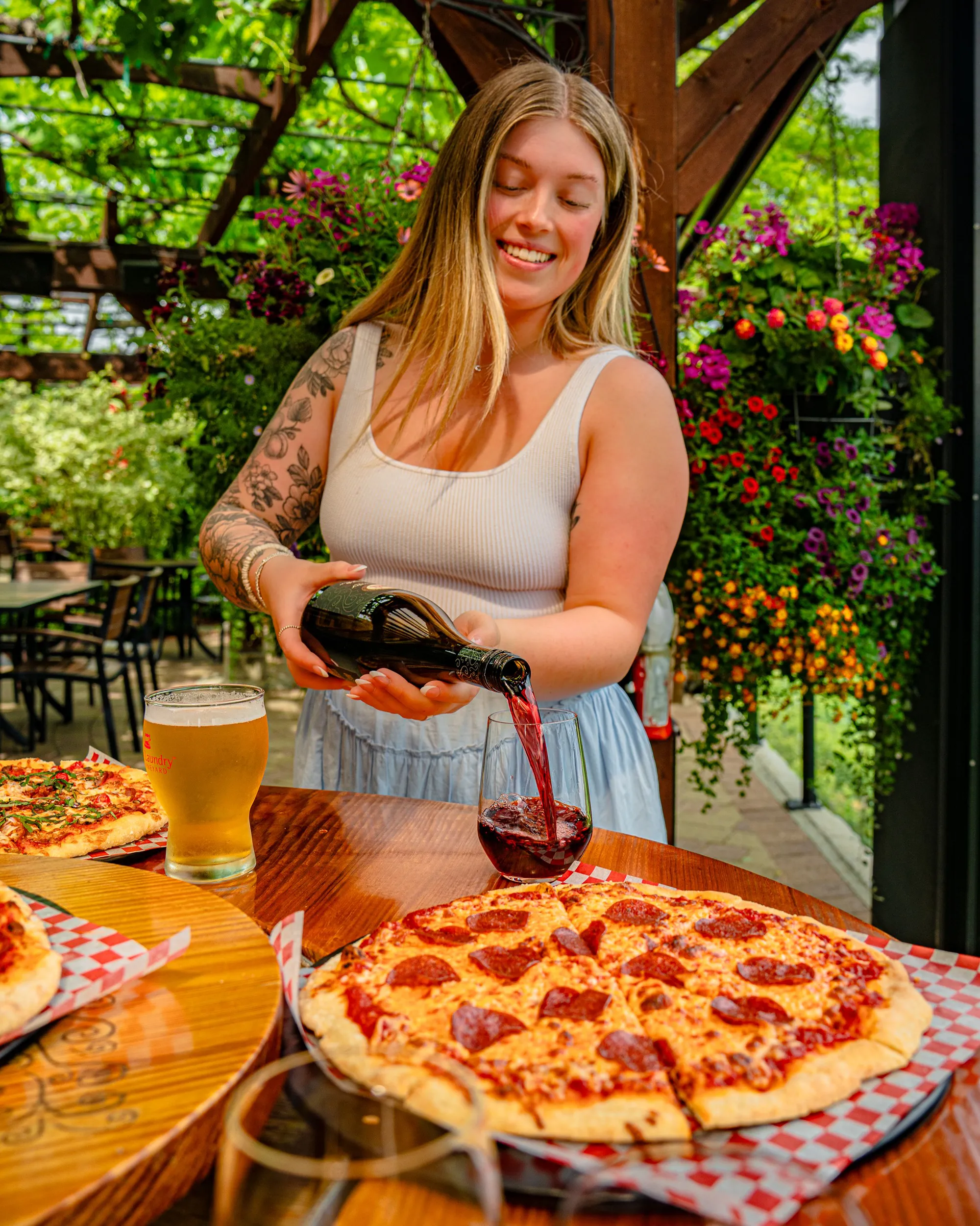 Wine being poured with a meal at Dirty Laundry Winery