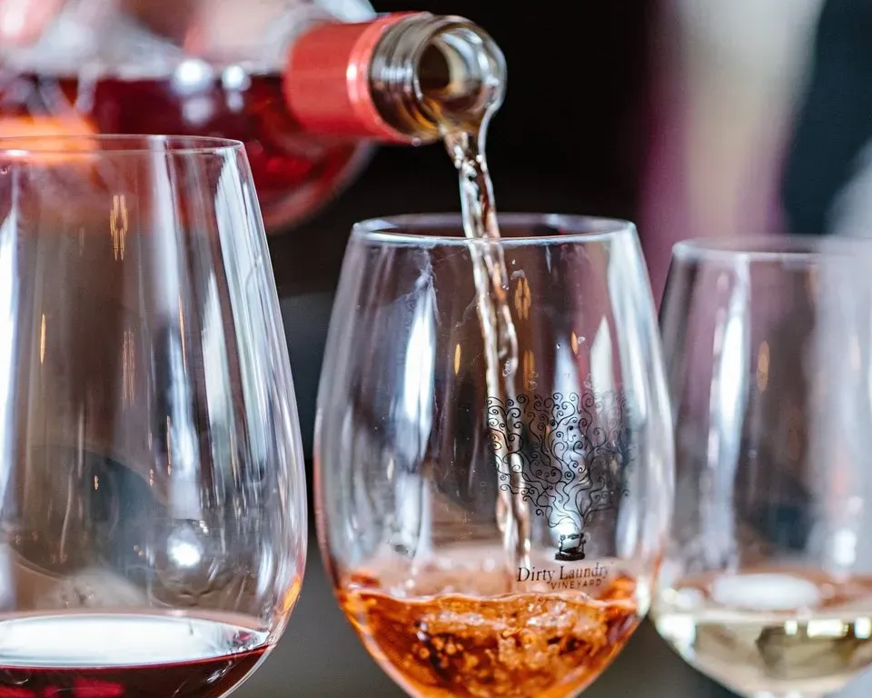 Pouring wine into glasses
